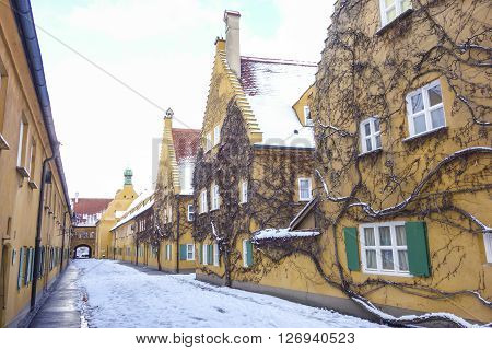 Augsburg Germany - January 17 2016:The Fuggerei is the world's oldest social housing complex still in use. It is a walled enclave within the city of Augsburg Bavaria.