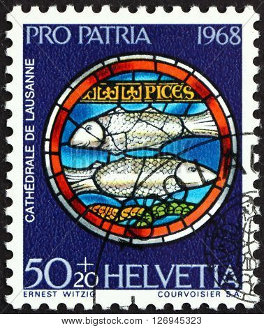 SWITZERLAND - CIRCA 1968: a stamp printed in the Switzerland shows Pisces Design from Rose Window Lausanne Cathedral circa 1968