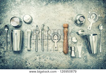Bar accessories and utensils for making cocktail. Shaker jigger strainer spoon. Vintage style toned picture