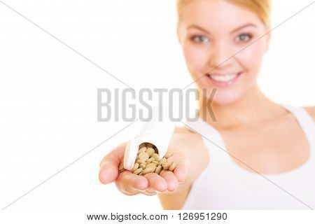 Young woman girl holding vitamins pills. Health care. Healthy lifestyle nutrition concept. Isolated on white background.