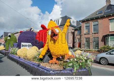 HILLEGOM, THE NETHERLANDS - APRIL 23, 2016: Moving platform made in a form of angry birds from the famous game and movie. Taking part in the  traditional flowers parade 