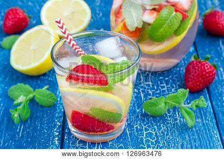 Strawberry mint homemade lemonade on blue wooden table
** Note: Shallow depth of field