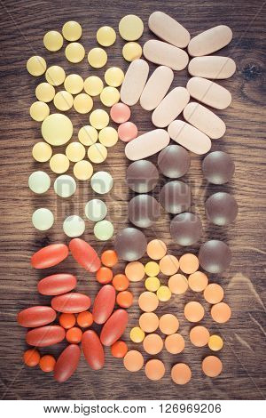 Vintage photo Heap of colorful medical pills capsules or supplements for therapy concept of treatment and health care