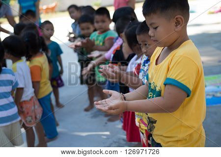 Yasothorn THAILAND DEC-01 : Health worker finding new case of Hand foot mouth disease in child on December 01,2015 at village in Yasothorn Thailand