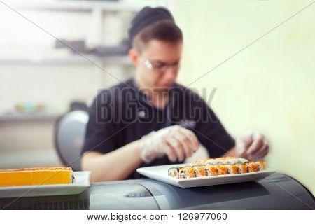 Cooks Preparing Sush