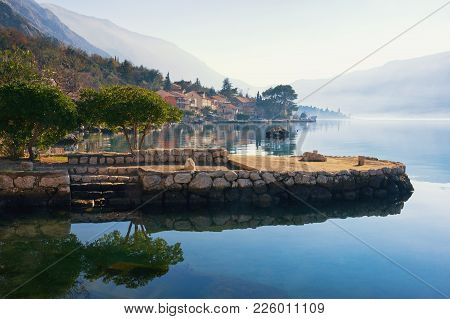 View Of Small Mediterranean Town Of Dobrota In Winter.  Montenegro, Bay Of Kotor