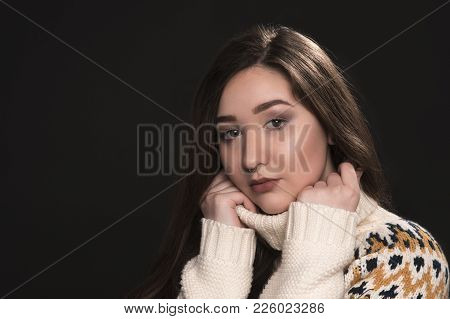 Young Beautiful Brunette Girl On Dark Background