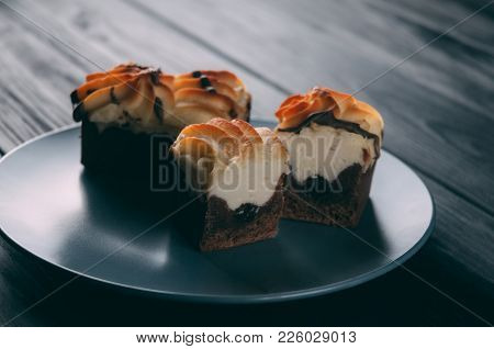 Curd Cake In A Plate Lies On A Wooden Background