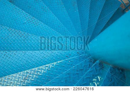 Spiral Stair Of Footbridge With The Sun Ray Light And Shadow In Daytime