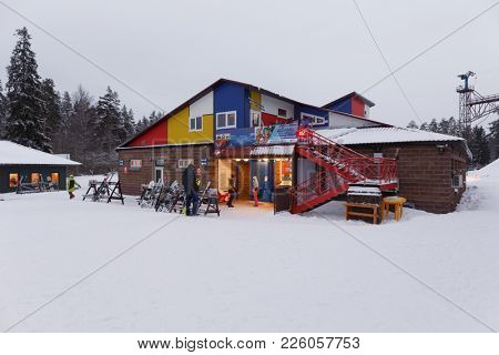 KRASNOE OZERO, LENINGRAD REGION, RUSSIA - FEBRUARY 1, 2018: People in ski resort Krasnoe Ozero during Freestyle Europa Cup. Athletes from 7 countries participate in competitions