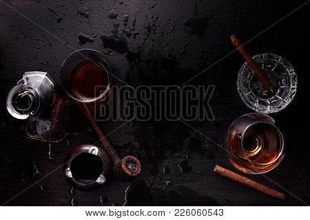 Glass Of Whiskey With Smoking Cigar.