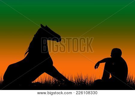 Horse And Man Silhouettes Sitting On Grass At Sunset