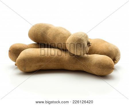 Tamarind Isolated On White Background Three Indian Dates In A Brown Brittle Shell