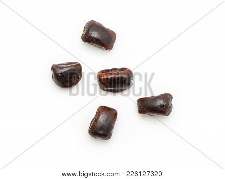 Five Tamarind Seeds Top View Isolated On White Background Indian Dates
