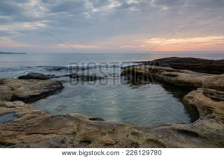 Sea Sunrise At The Black Sea Coast Near Ravda, Bulgaria. Rocky Sunrise.