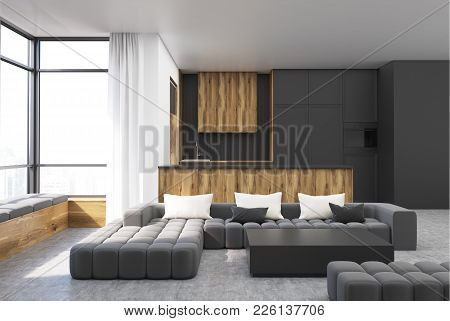 Black And Wooden Living Room Interior With A Black Sofa, A Balck Square Coffee Table And A Kitchen I