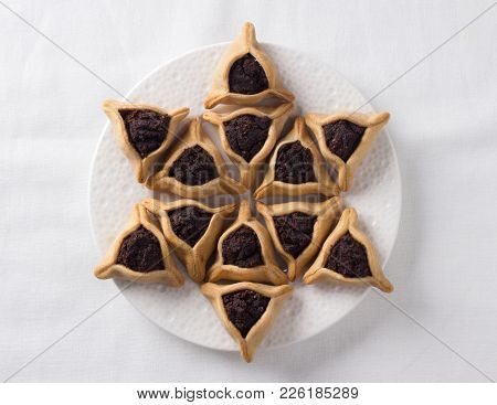 Traditional Sweets For Jewish Holiday Of Purim. Hamantashen Cookies Or Aman Ears, Triangular Cookies