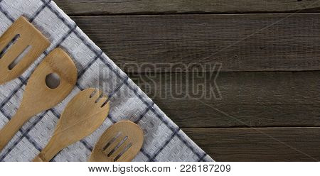 Wooden Kitchen Appliances Napkin And Notebook, On A Wood Background.