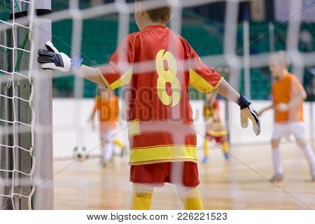 Football Futsal Training For Children. Indoor Football Goalkeeper Standing In Goal. Indoor Soccer Yo