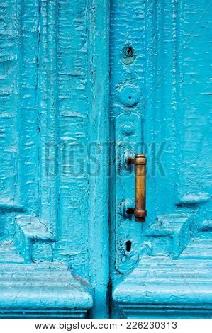 Close-up Keyholes With Curtains And A Handle On The Blue Many Times Painted Cracked Double-barreled 