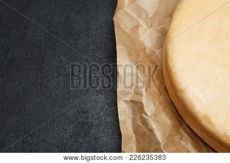 Whole Round Head Of Parmesan Or Parmigiano Hard Cheese On Concrete Background Or Table