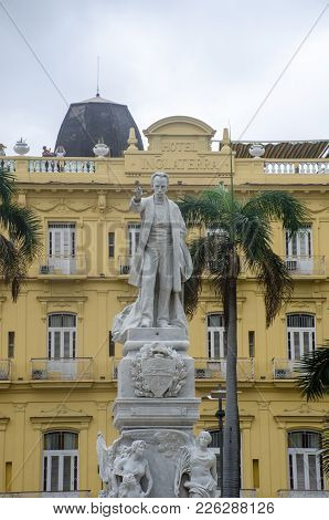 Havana Cuba - 26 January 2018:  Statue Of Jose Marti In Parque Central Havana With Hotel Inglaterra 