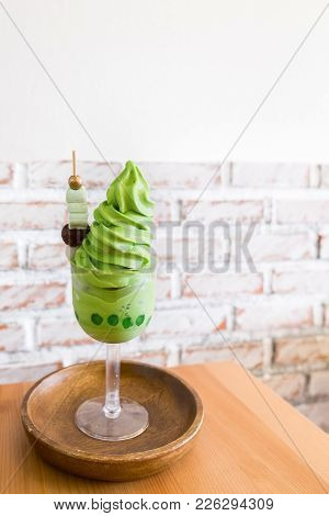 A Glass Of Green Tea (matcha) Ice Cream Soft Cream With Bubble, Marshmallow, Red Bean And Mochi On W