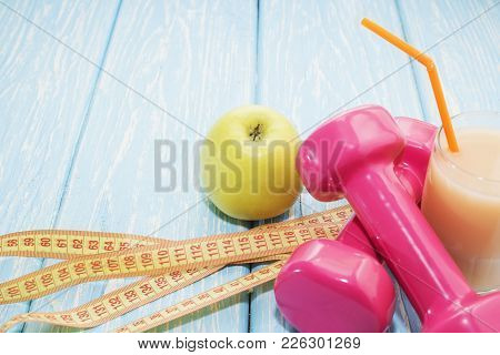 The Concept Of A Healthy Diet. Small Dumbbells, Juice. Bananas. Oranges. Apples. Healthy Lifestyle. 