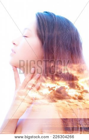 Bright aspects of nature are highlighted along with her peaceful and relaxed expression; letting go of her worries in the perpetual waves of the ocean