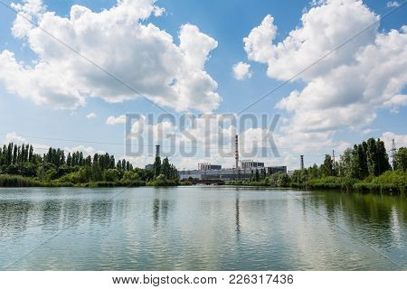 Pond Cooler At Nuclear Power Plant Summer Clouds Pipes