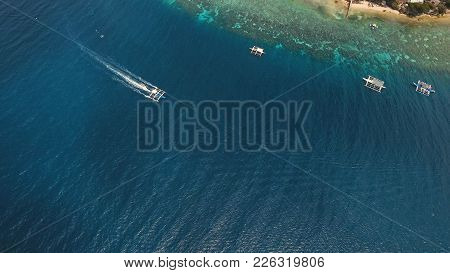 Aerial View Of Motor Boat In Sea, Moalboal. Aerial Image Of Motorboat Floating In A Turquoise Blue S