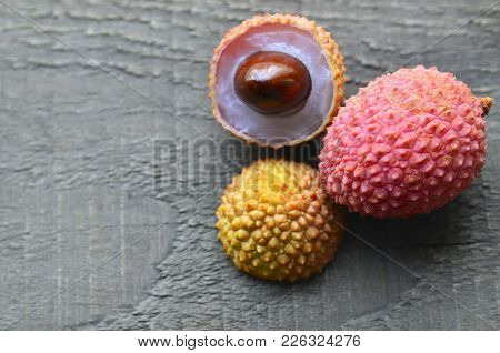 Fresh Organic Lychee Fruits And On A Rustic Wooden Background.exotic Tropical Litchi Berry.lychees.r