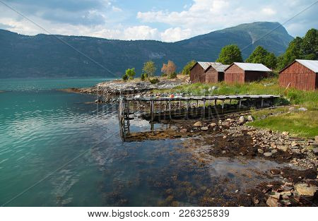 Scenic Red Barns Near Sognefjord In Norway