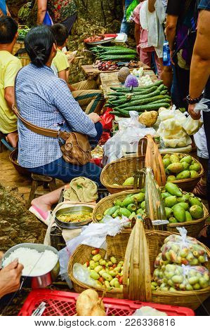 China Guizhou Village Vendor Selling Fruits On Street, August, 2014, Guizhou, China.