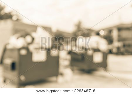 Overflowing Dumpster At Apartment Building Yard In America