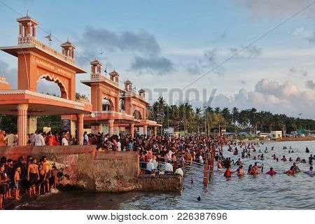 Rameshwaram, India - November, 21st, 2017. Hindu People People Bathing In The Arabian Sea Before Ent