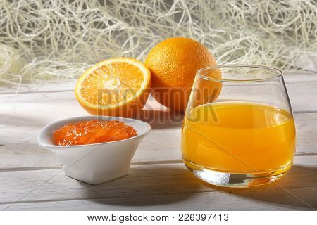 Orange Jam And Juice In Glass. Morning Breakfast