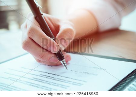 Close Up Business Man Reaching Out Sheet With Contract Agreement Proposing To Sign.full And Accurate