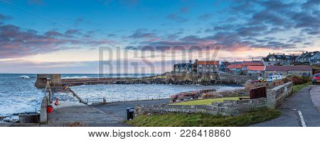 Craster Harbour And Village Panorama, Craster Is A Small Fishing Village On The Northumberland Coast