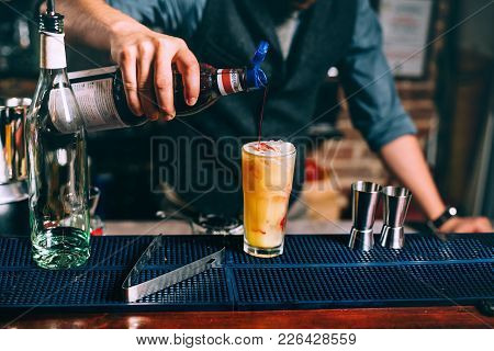 Close Up Details Of Professional Barman Closing The Cocktail With Syroup. Alcoholic Drinks Close Up