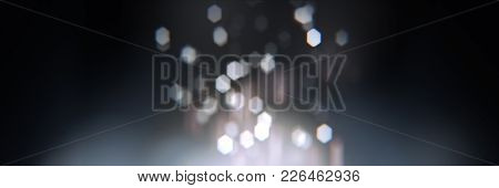 Realistic Bokeh With Geometric Hexagonal Iris. Soft  Slightly Pink Abstract Background With Light Pa