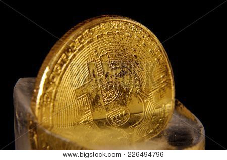 Golden Bitcoin Frozen In The Ice As A Concept Of Restrictions