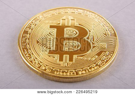 Golden Coin As A Symbol Of Bitcoin Crypto Currency Isolated On The Gray Background