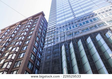 Shot Taken Looking Up Toward Two Tall Buildings In Chicago, Illinois.