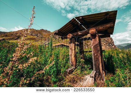 Wide-angle Shooting Of Forsaken Wooden Shaft Well Surrounded By Hills, Cannabis And Fleabane Native 
