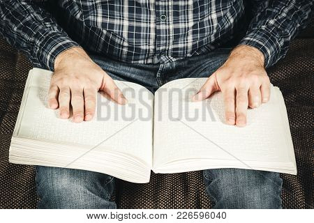 The Blind Man Was Reading A Book Written On Braille. Touch Your Finger On The Braille Code. A Book W