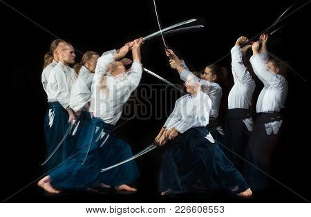 Man And Woman Fighting At Aikido Training In Martial Arts School With Saber. Healthy Lifestyle And S