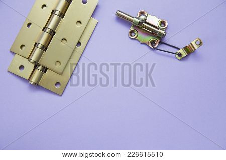 Home, House Repair, Redecorating, Renovating Concept.a Door Hinges On A Blue Background, Top View, F