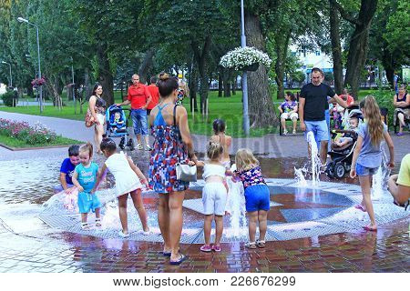 Chernihiv / Ukraine. 20 August 2017: Happy Children Playing On The Playground With Fountains In Cher