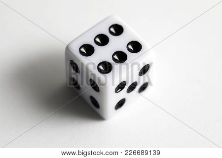 Dice Shot Up Close On A White Background, Six